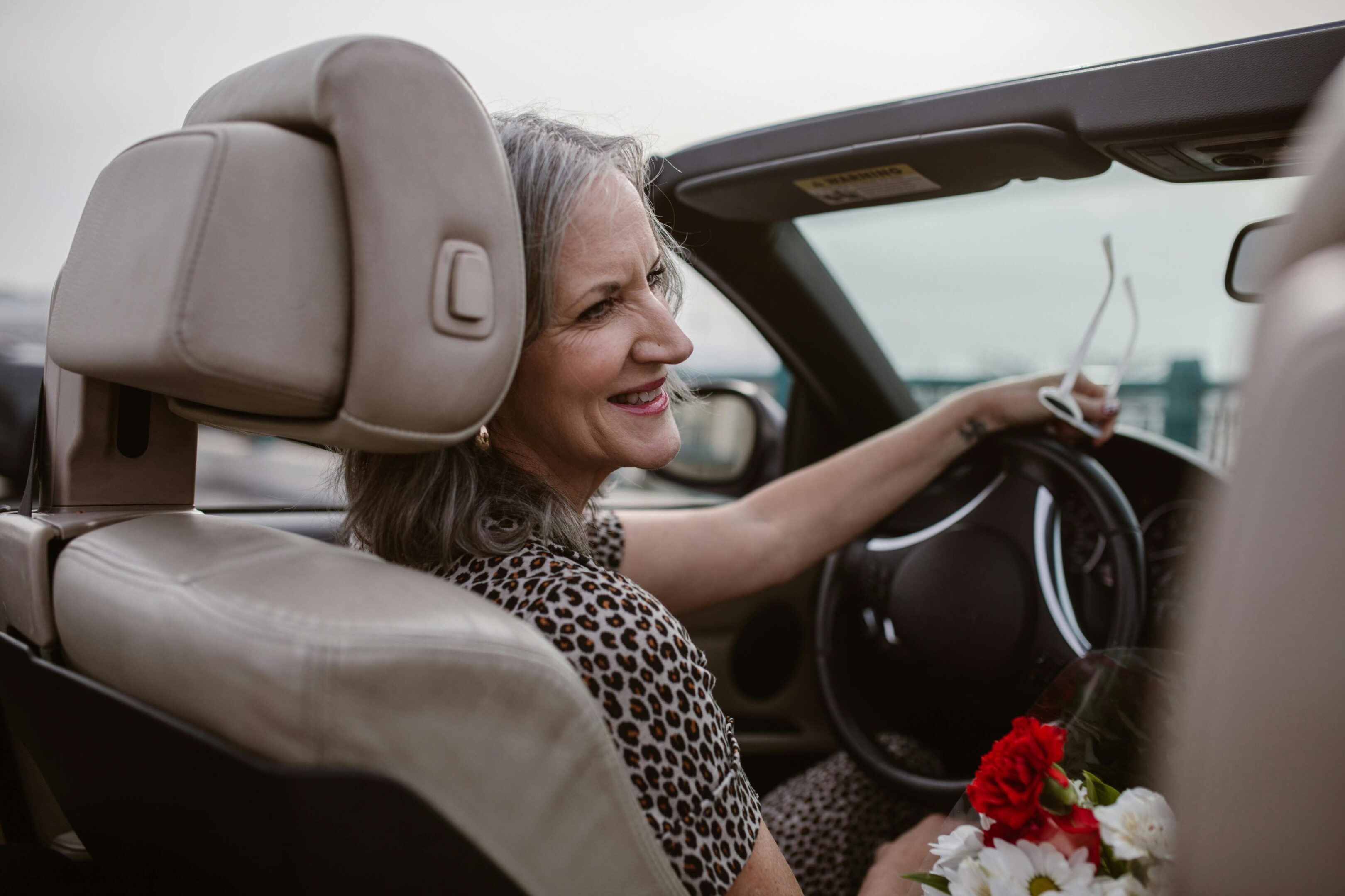 A closeup look at a woman and a man sitting in a car